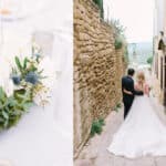 Couple marchant main dans la main dans une ruelle pittoresque de Provence, entouré de murs en pierre et de paysages verdoyants, symbolisant un mariage romantique et élégant. Cette scène évoque une cérémonie grandiose, parfaite pour une organisation sur mesure par un wedding planner de luxe. Les détails floraux délicats sur la table à proximité soulignent l'atmosphère sophistiquée d'un événement unique, idéal pour une célébration mémorable en Côte d'Azur ou