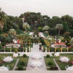 Un cadre enchanteur pour un mariage de luxe à Provence, Côte d'Azur et Corse, avec des tables élégamment dressées dans un jardin romantique. Cette cérémonie grandiose se déroule dans un domaine privé, entouré de paysages pittoresques et de jardins luxuriants. L'atmosphère sophistiquée et la décoration sur mesure soulignent l'expertise de By Mademoiselle C dans l'organisation d'événements uniques. Chaque détail contribue à créer une célébration exceptionnelle,