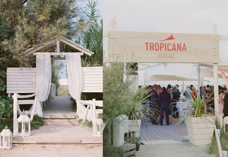 Une élégante entrée en bois mène à un événement de luxe sur la plage, parfaitement organisé par By Mademoiselle C, spécialiste des mariages sur mesure en Provence, Côte d'Azur et Corse. Cet espace romantique, entouré de verdure et d'une atmosphère sophistiquée, est idéal pour une cérémonie grandiose ou une célébration unique. Les lanternes blanches ajoutent une touche de charme à cette destination exceptionnelle, faisant de chaque moment une partie intégrante d'un