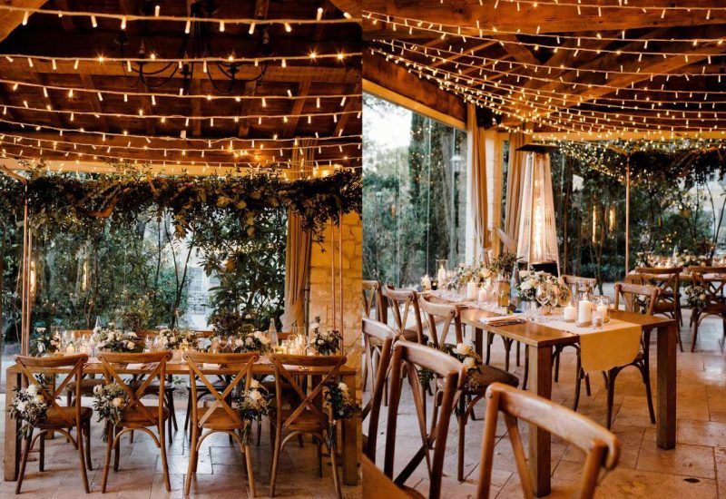 Élégante salle à manger d'un domaine privé en Provence, décorée de guirlandes lumineuses pour une atmosphère romantique. Cette image illustre un mariage de luxe, avec des tables soigneusement dressées pour une célébration grandiose. L'organisation sur mesure de cet événement unique met en avant des éléments de sophistication, entourés de verdure luxuriante, créant ainsi un cadre parfait pour un rêve de mariage. Les fleurs délicates et la lumière douce ajoutent